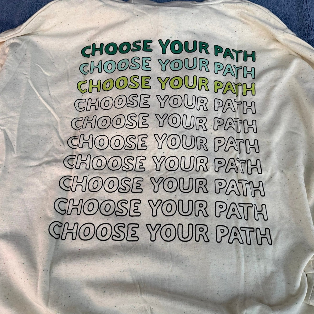 Choose Your Path repeating graphic on the back of the cream Star Wars hoodie