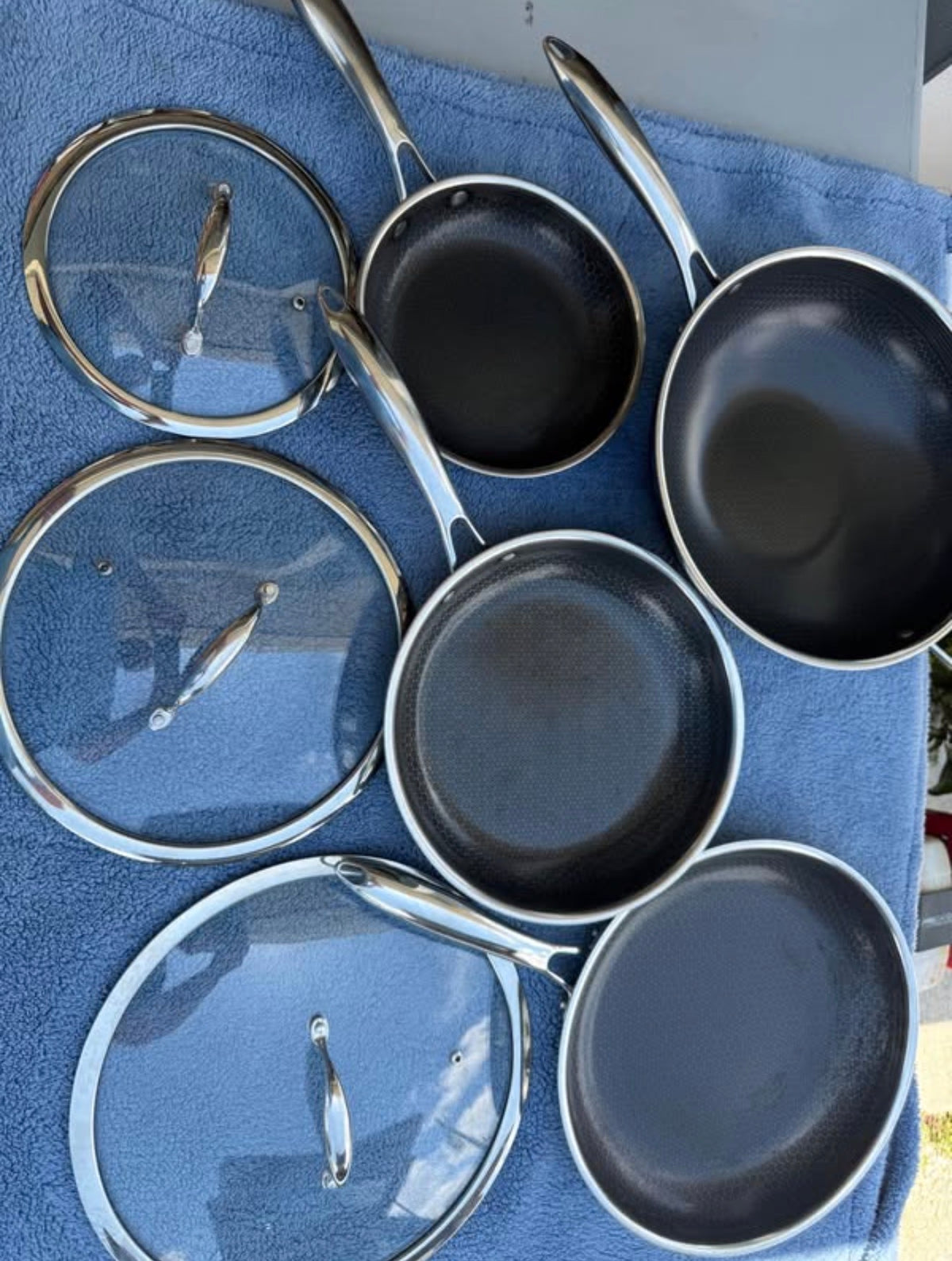 Pre-owned HexClad seven-piece hybrid cookware set with pans, lids and wok
