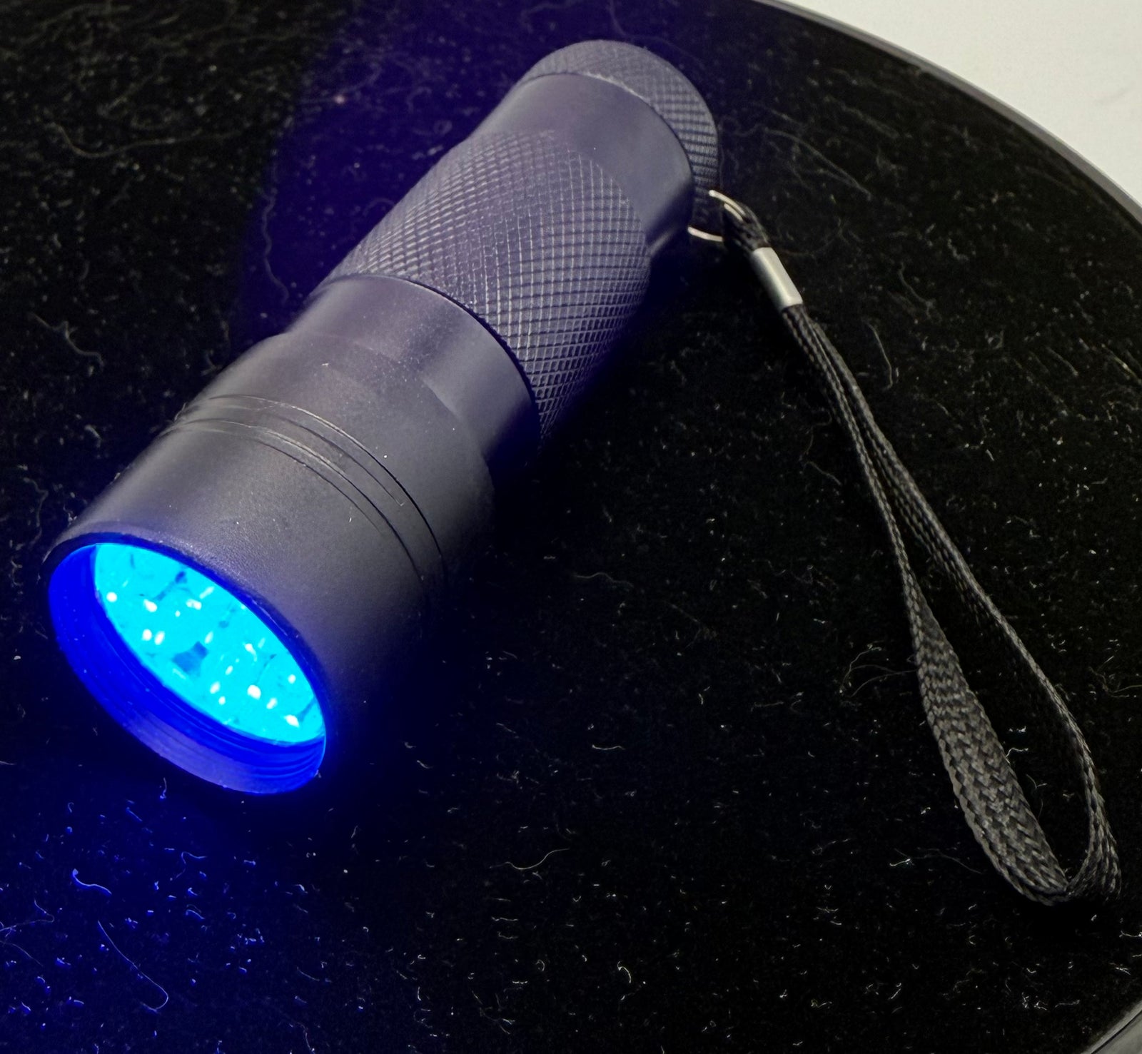 Black Flashlight with Blue LED Light - product image 1