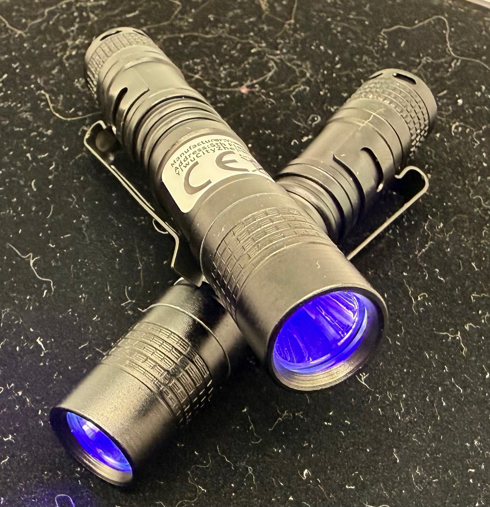 Pair of mini handheld UV LED blacklight flashlights — product photo