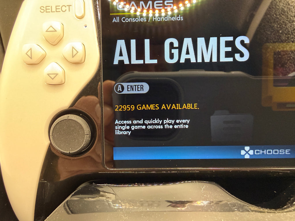 Close-up of SF3500 handheld game console game selection screen and controls