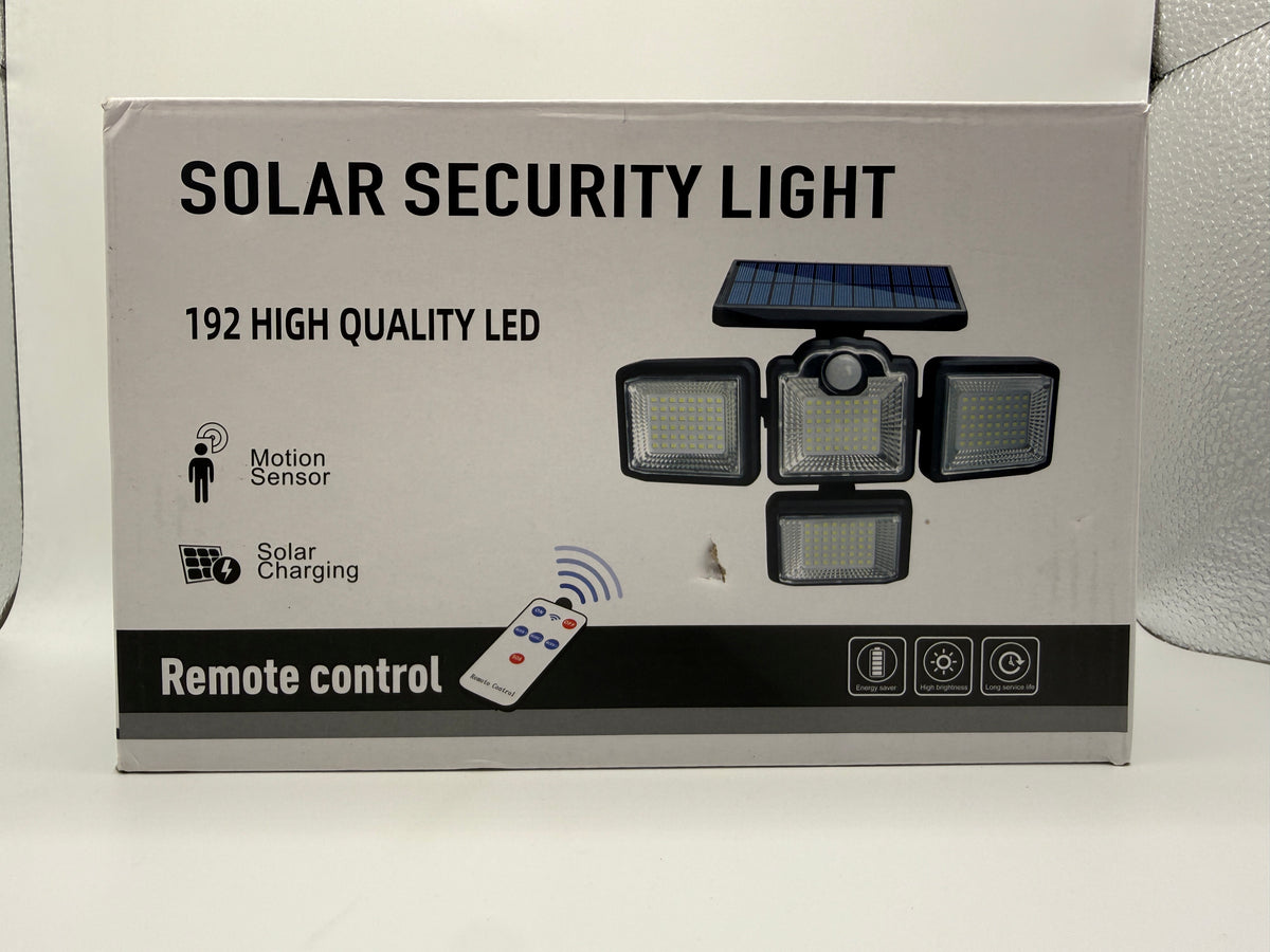 Front view of Solar Security Light box showing 192 LEDs and remote control