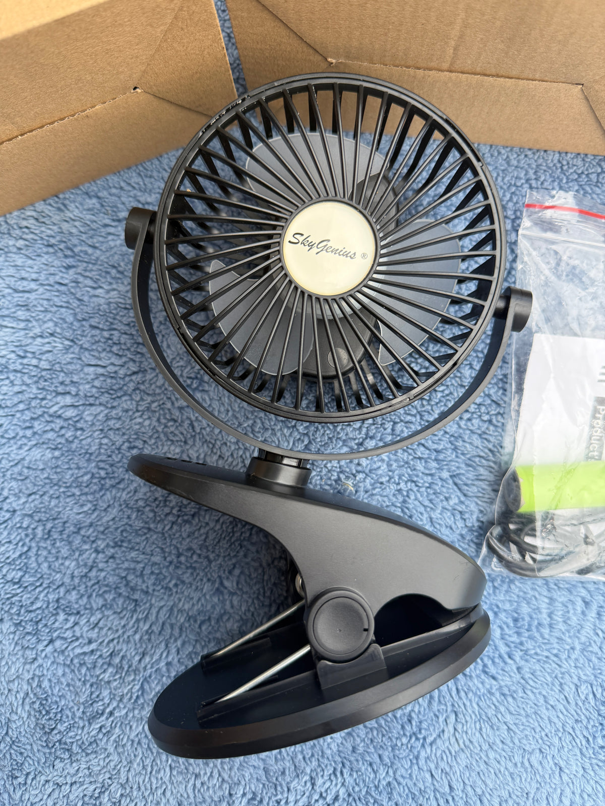 3 boxed SkyGenius mini battery fans