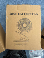 Close up of SkyGenius mini clip fan showing fan blades and clip