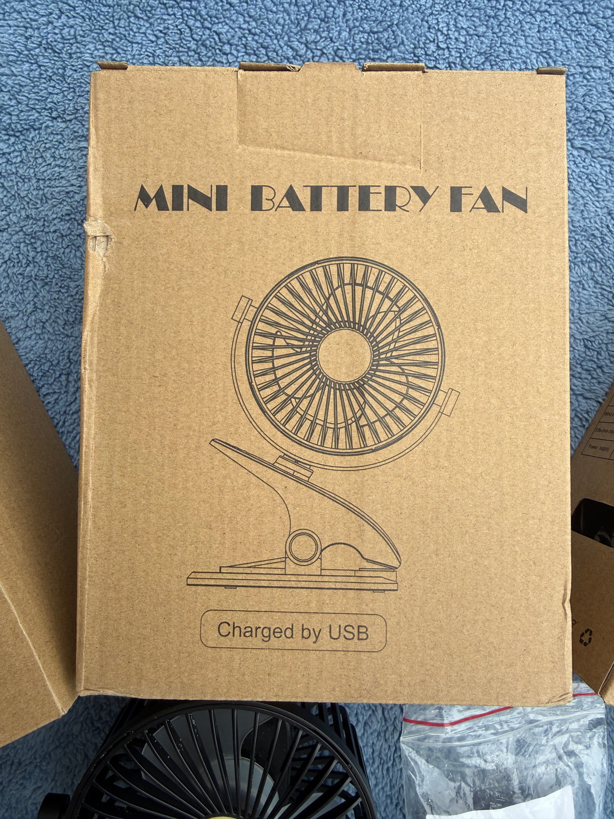 Close up of SkyGenius mini clip fan showing fan blades and clip