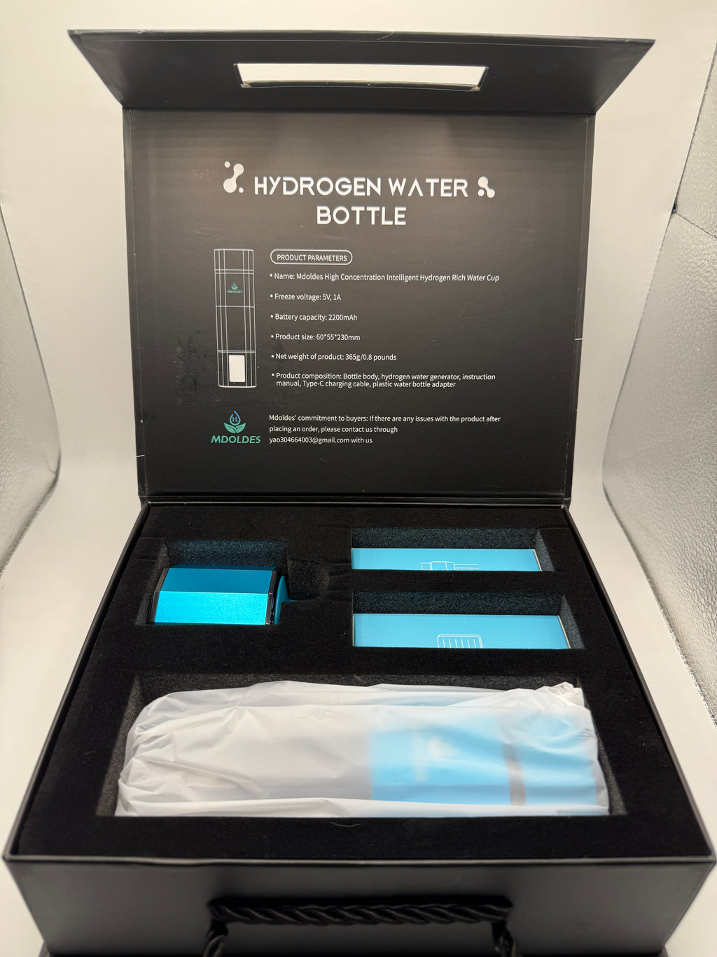 Mdoldes Hydrogen Water Bottle open packaging with contents visible