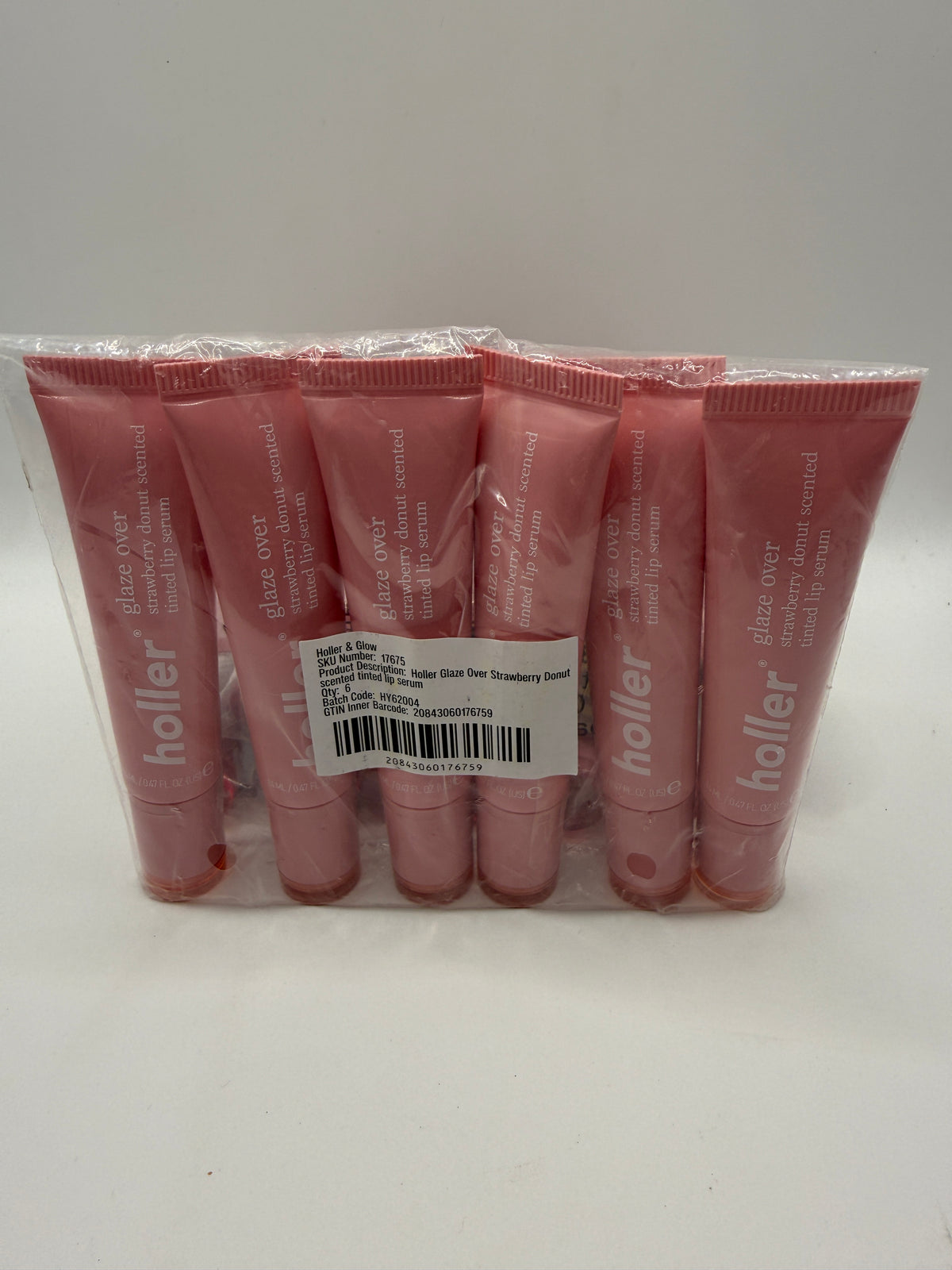 Pack of six Holler Glaze Over Strawberry Donut scented tinted lip serum tubes