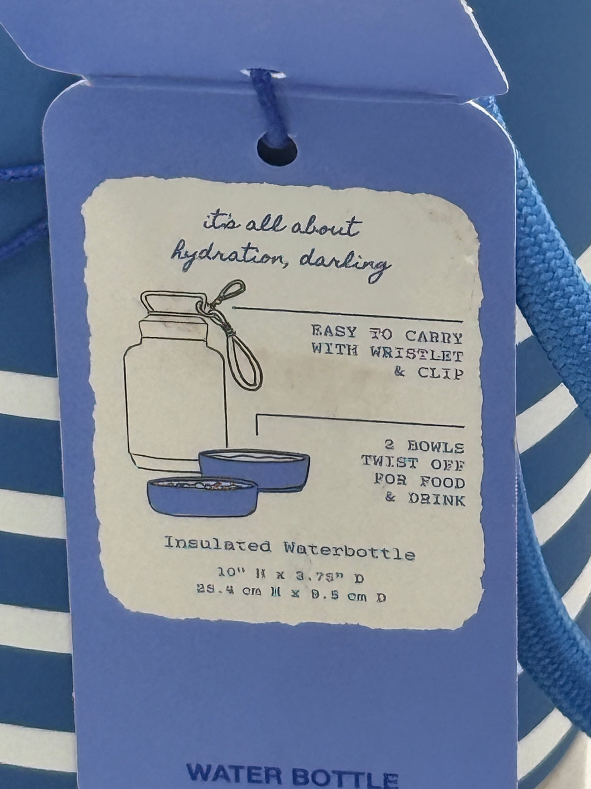 Back tag detail of Hooray House dog water bottle with instructions and barcode