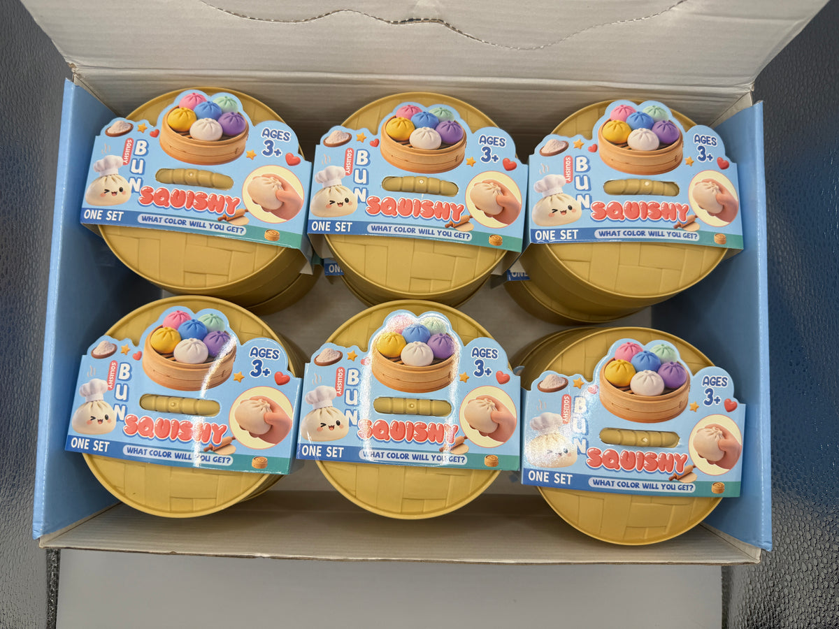 Case of 12 Bun Squishy toys in bamboo steamer style containers