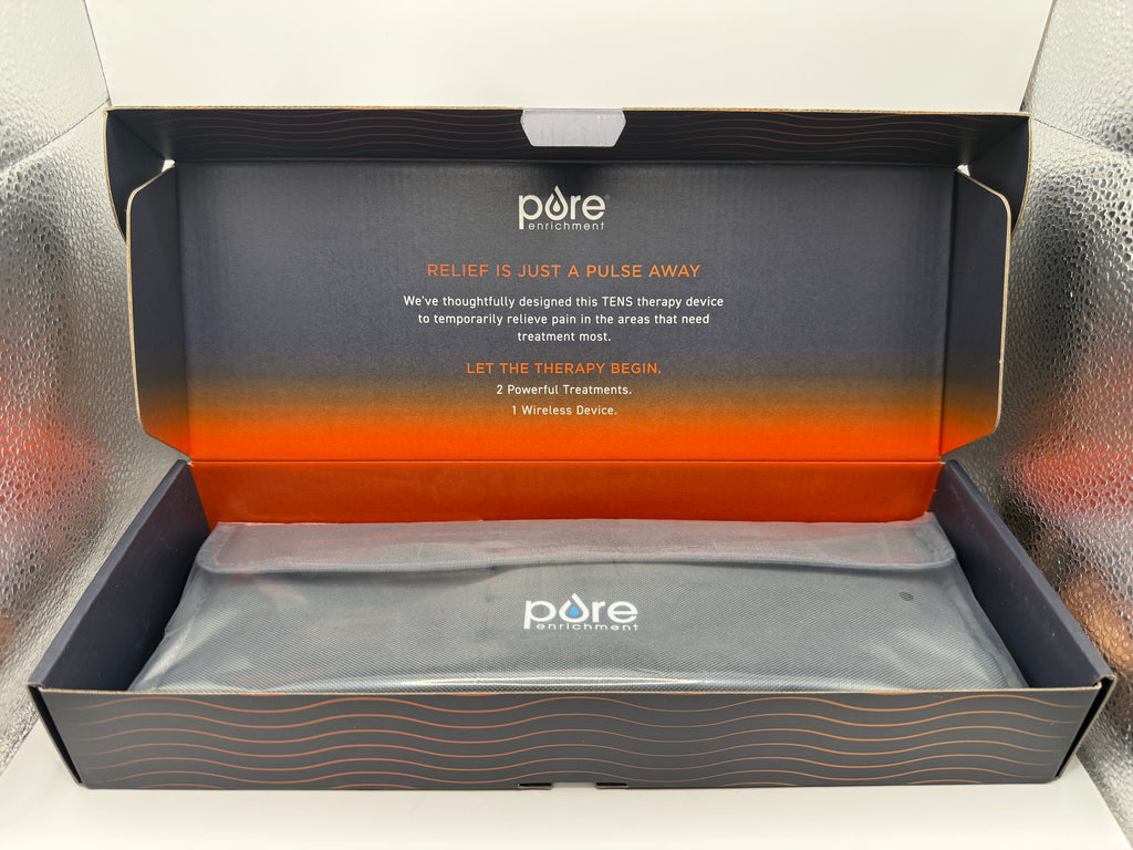Open box showing PurePulse Go Wireless TENS Therapy device in storage bag