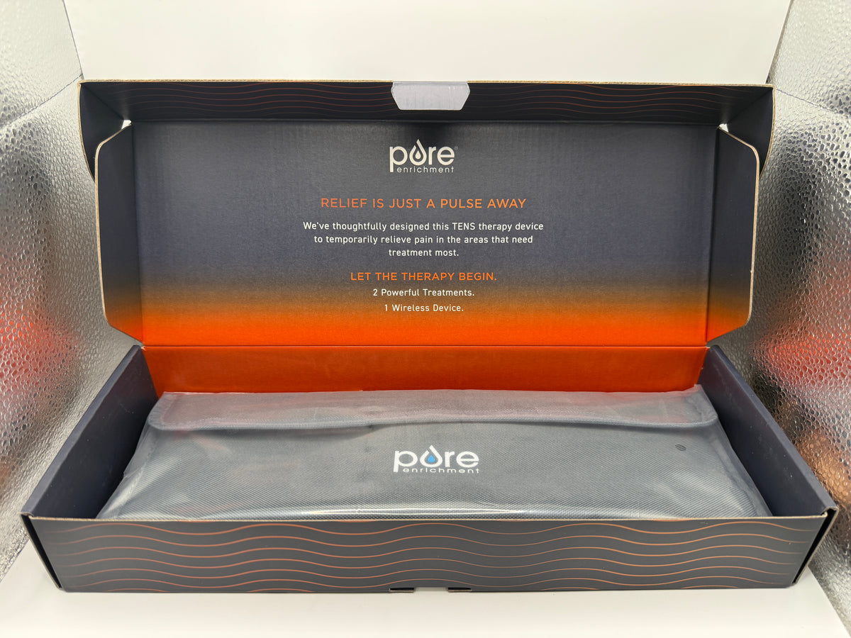 Open box showing PurePulse Go Wireless TENS Therapy device in storage bag