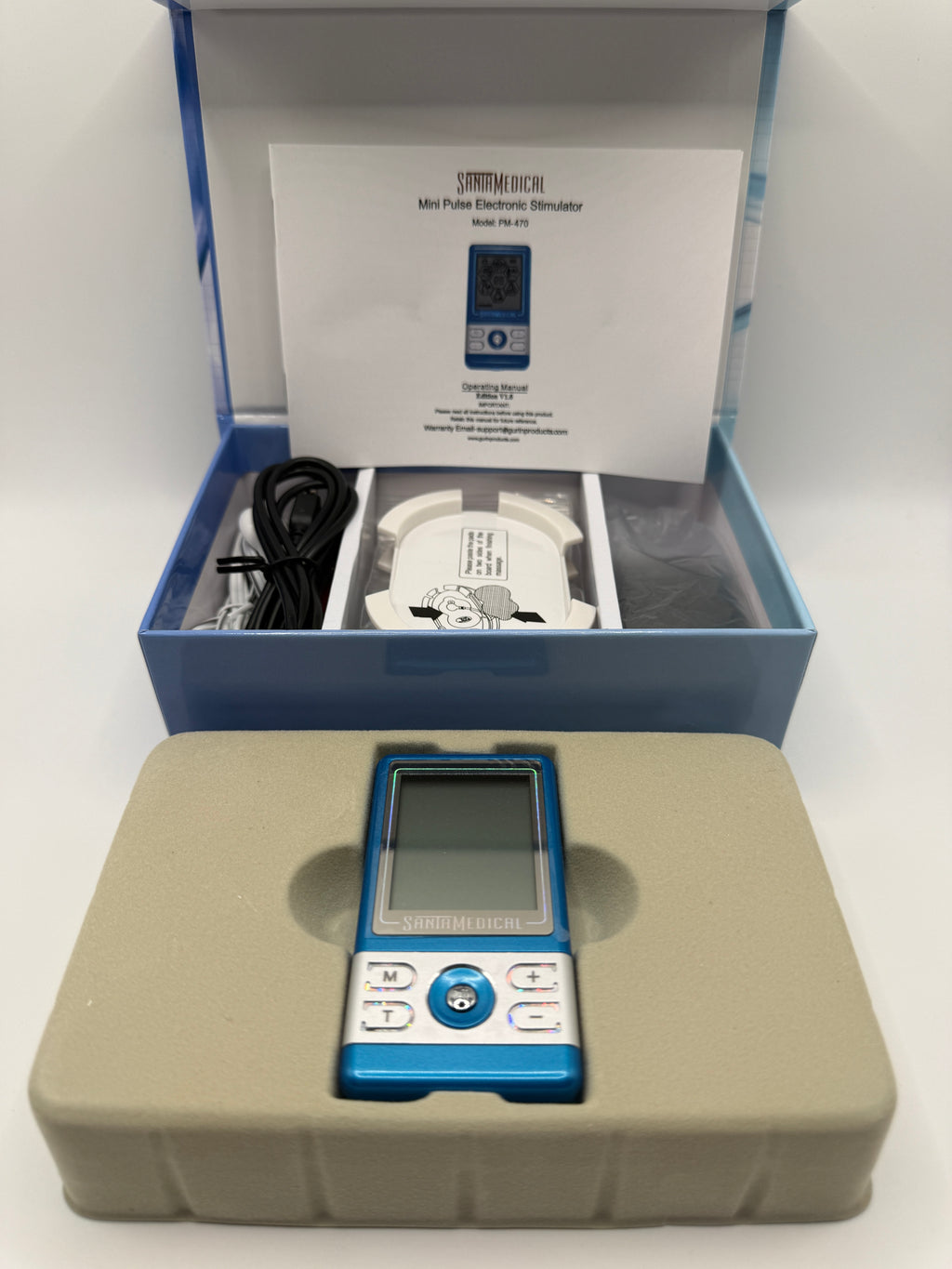 Close-up of SantaMedical ElectroTherapy TENS unit in packaging