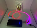Braided multi-port USB charging cable with LED light connected to power bank