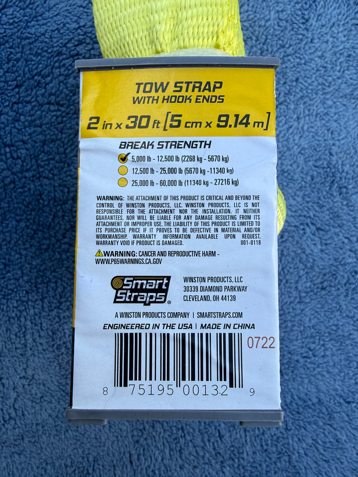 Back packaging label showing tow strap specs and barcode