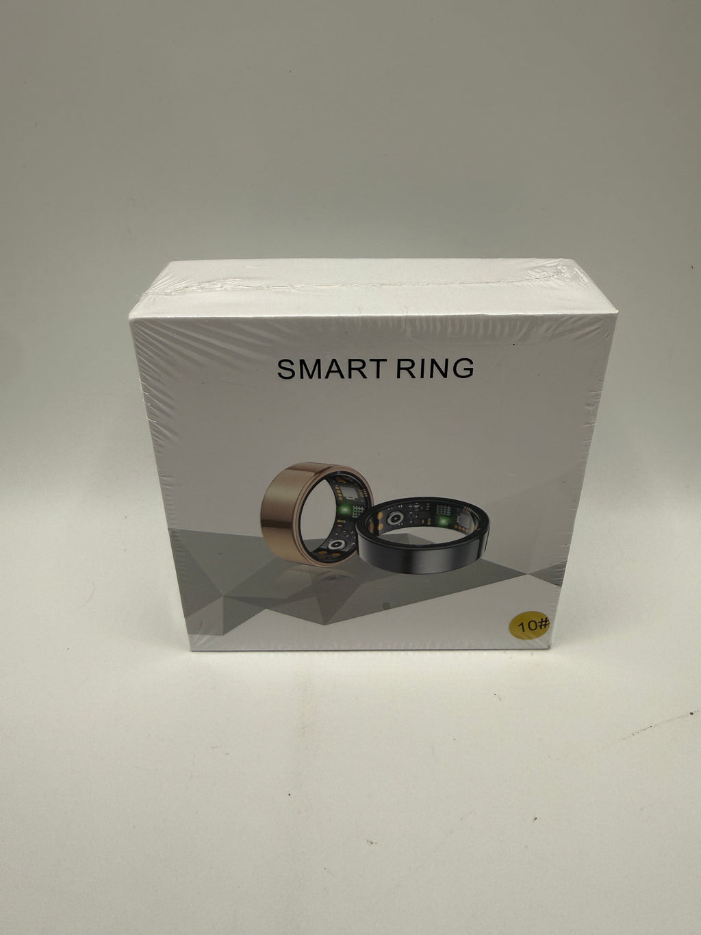 Smart Ring in gold and black displayed on box front