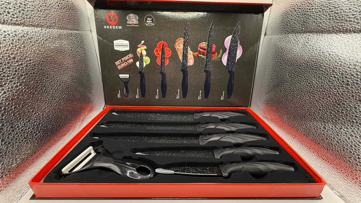 Opened HEESM knife set box showing knives and ceramic peeler inside