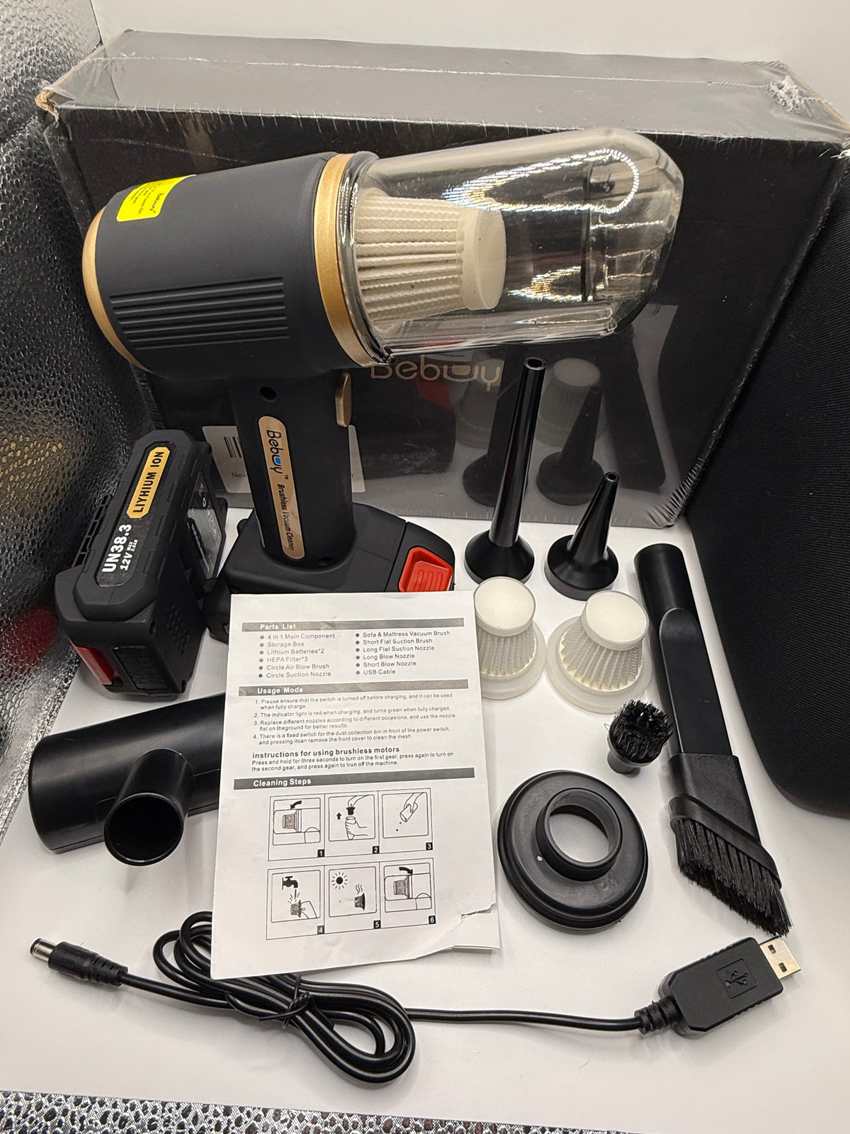 Instruction manual and accessories for Bebuy handheld vacuum