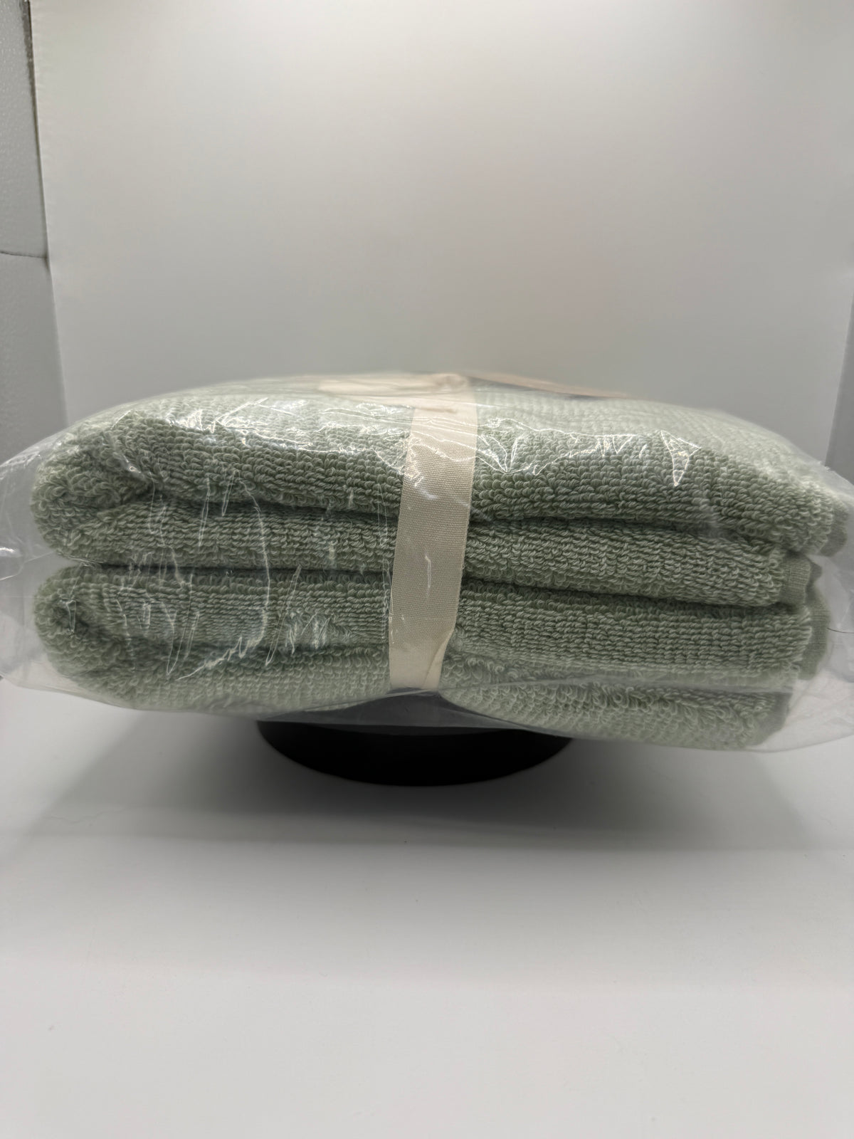 Side view of WELLBE hand towels folded and tied