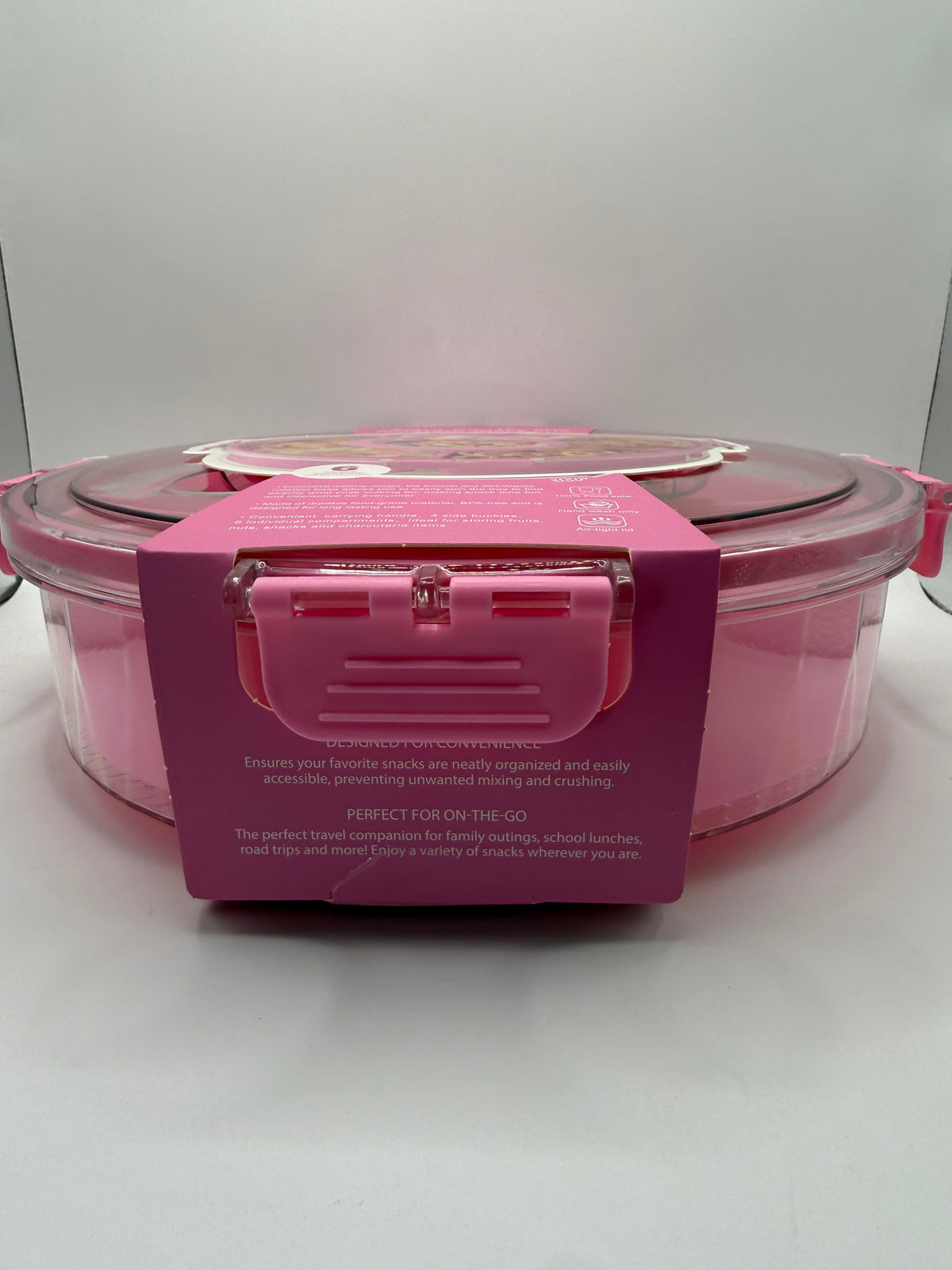 Side view showing security buckles on snack box