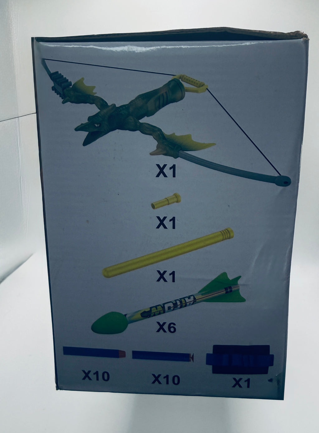 Contents of Dinosaur Bow and Arrow Toy Set including bow, arrows, and accessories