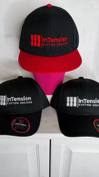 Embroidered InTension Custom Designs caps from Roselyn Rosado’s portfolio