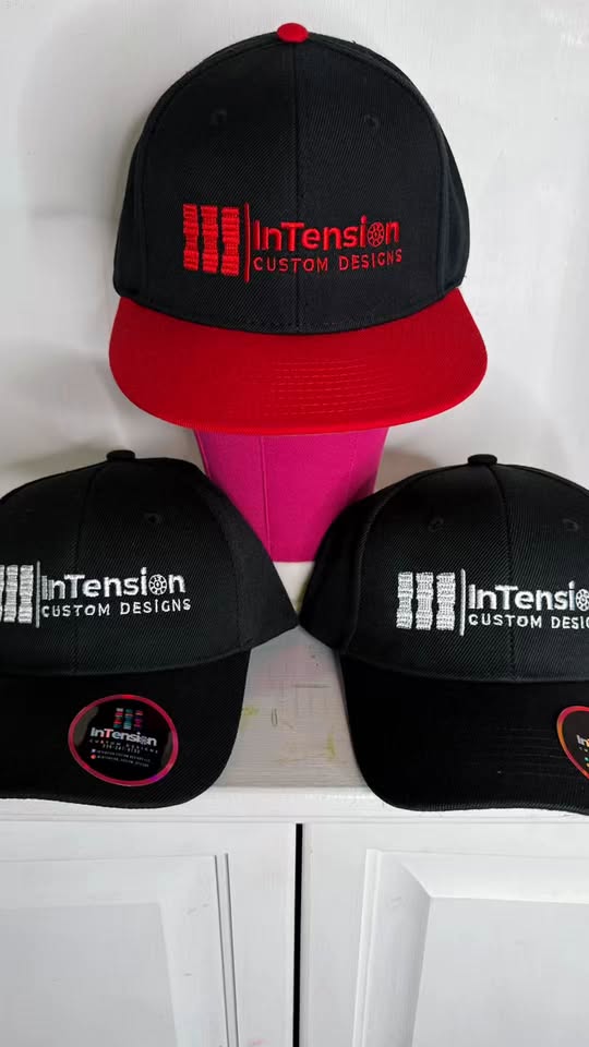 Embroidered InTension Custom Designs caps from Roselyn Rosado’s portfolio