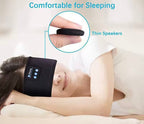 Marketplace239 LLC black Bluetooth sleep headband with ultra-thin speakers worn by a woman resting on a pillow