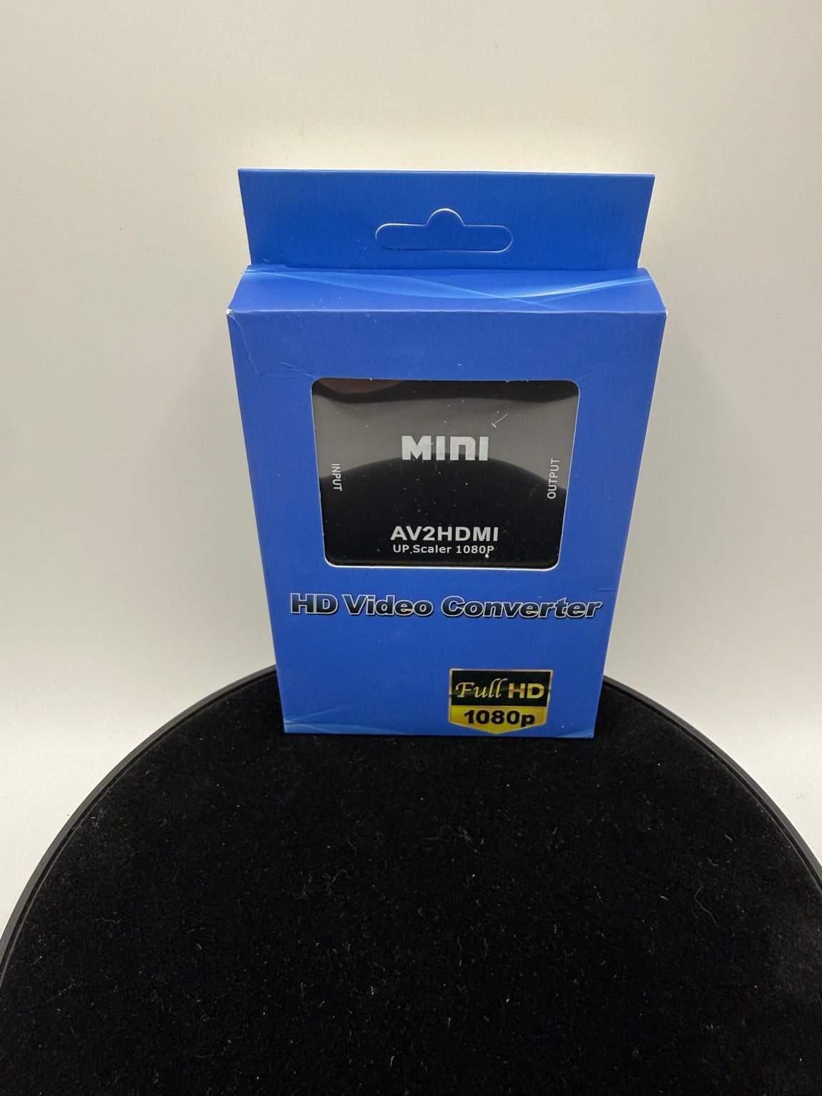 Black Mini AV2HDMI 1080p converter in blue retail box